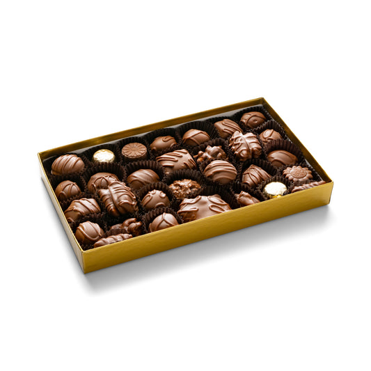 A gold gift box with 1 pound of assorted milk chocolates including caramels, creams, turtles, toffees, cashew, almond, and pecan clusters, coconut haystacks, molasses chips, peanut butter smoothies and peanut butter smidgens