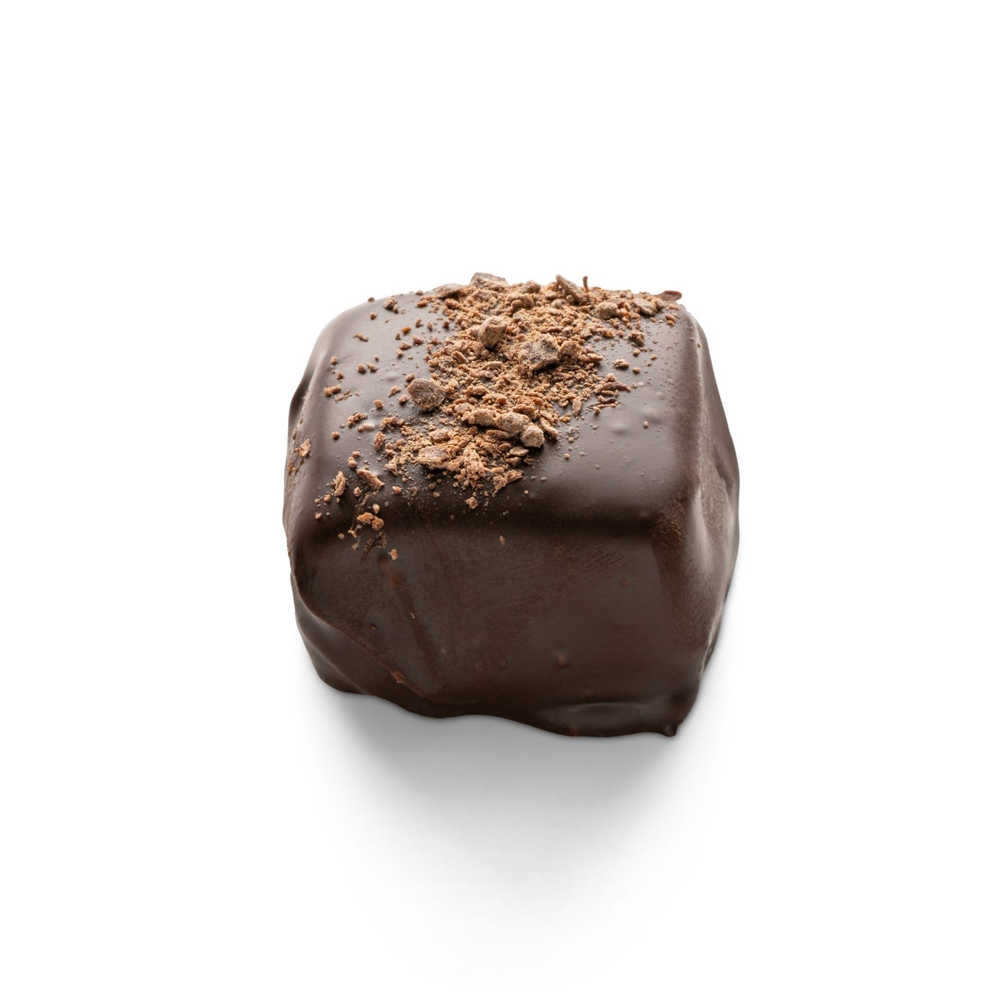 Dark chocolate covered truffle with espresso sprinkled on top, pictured with a white background