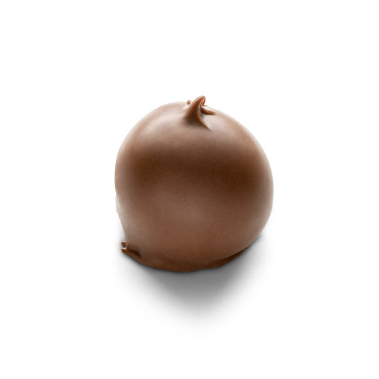 A single cherry covered in milk chocolate