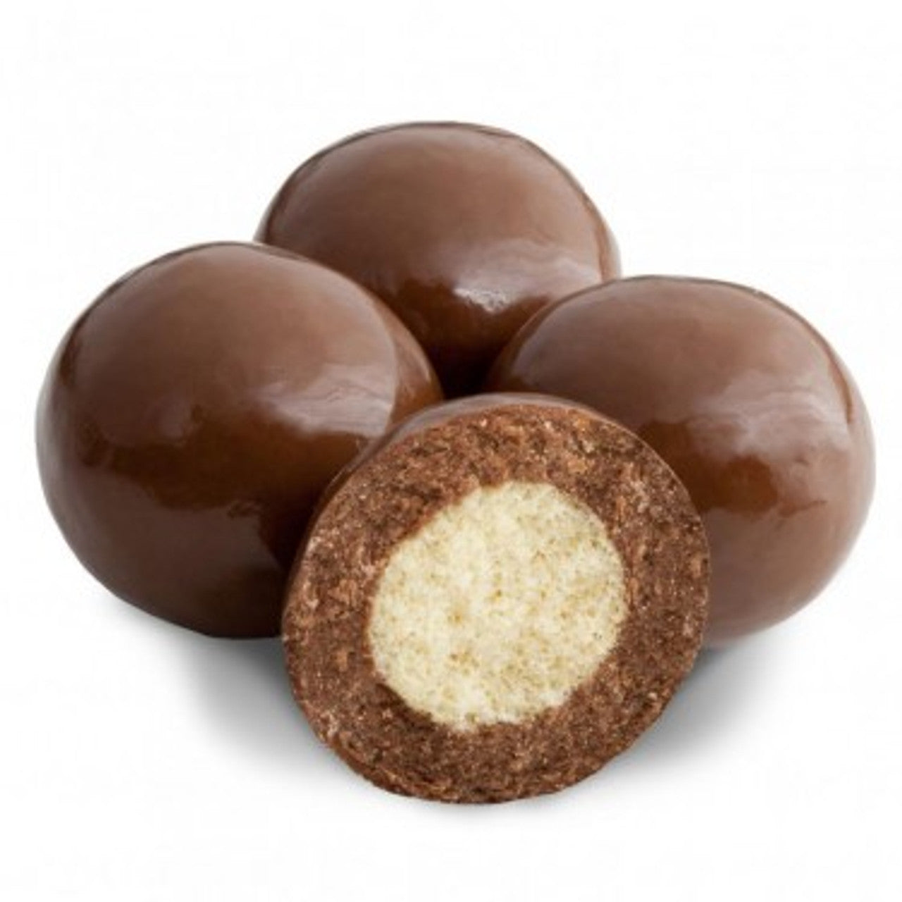 Milk chocolate malt balls coated in chocolate with a malt ball cut in half and a white background