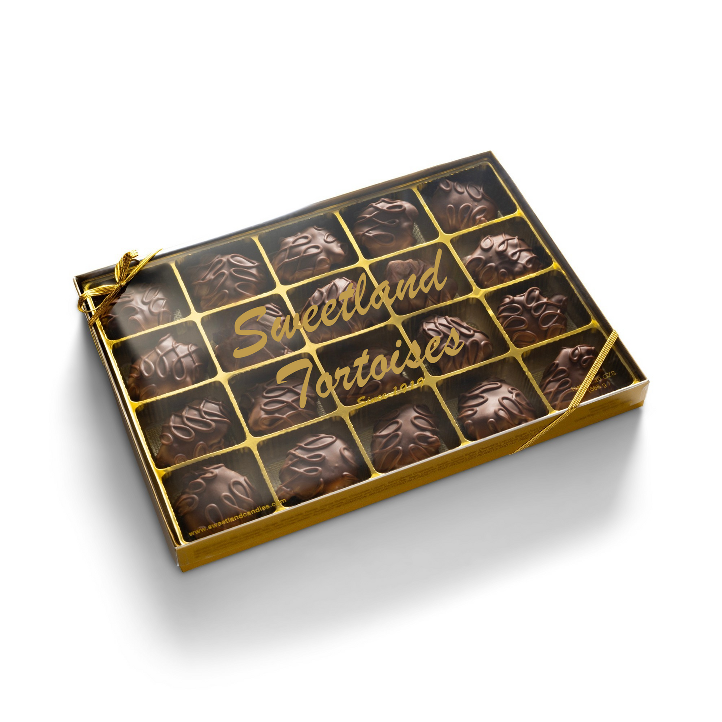 A gold gift box with 20 milk chocolate turtle candies