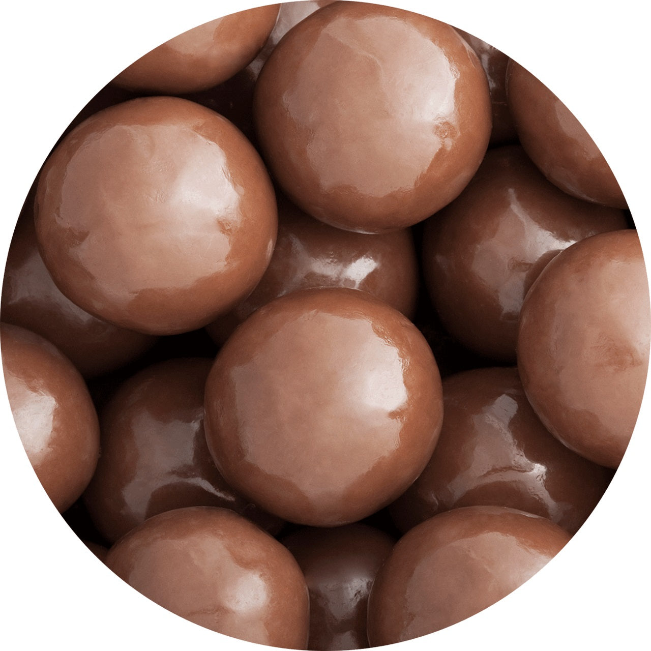 Malt balls coated in three layers of chocolate showing shiny coating of candy
