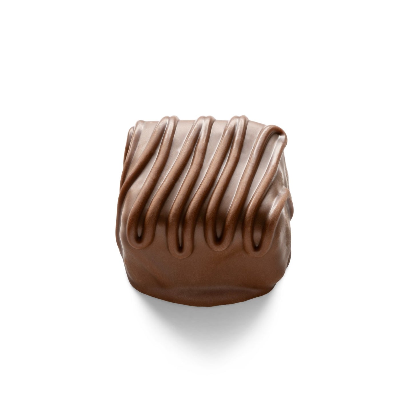 A truffle candy coated in double milk chocolate studio image