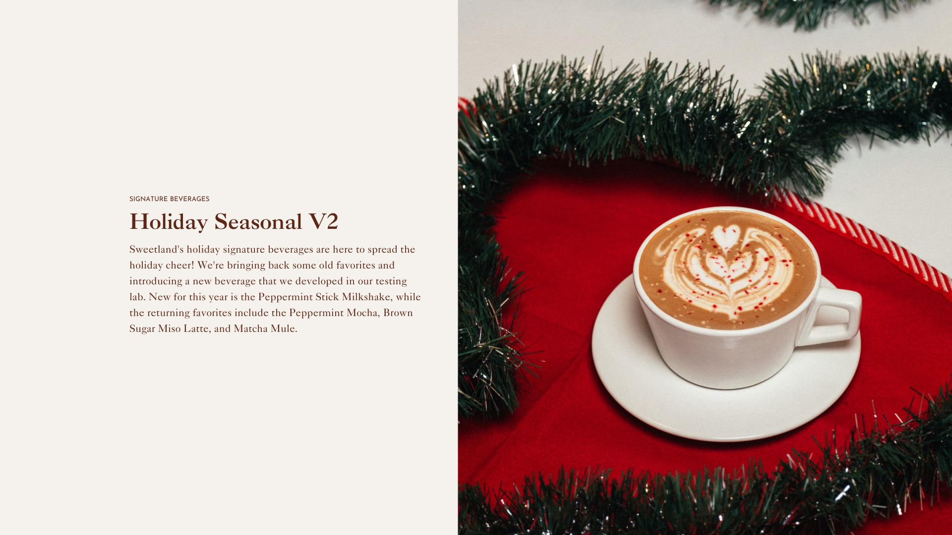 White cup of coffee on a red surface surrounded by Christmas decorations.