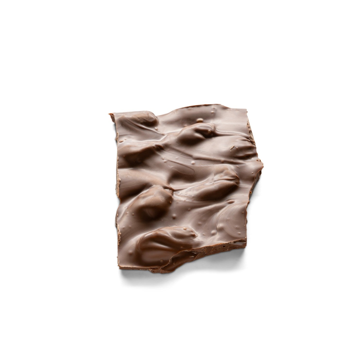 Almonds mixed with milk chocolate spread into a thin piece of bark