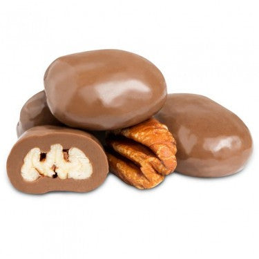 Milk chocolate-covered pecans on a white background