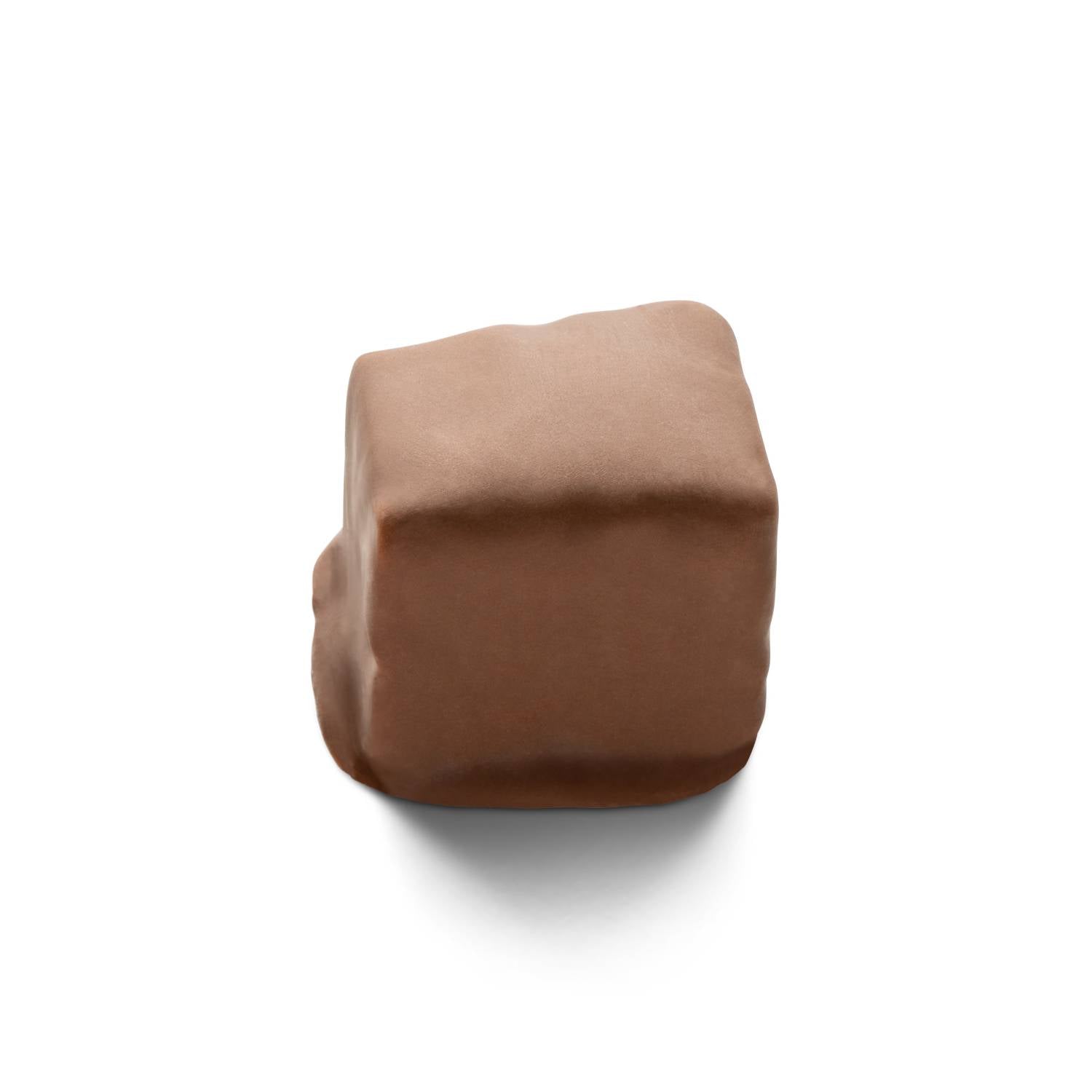 Seafoam, or sponge candy, covered in milk chocolate cut into a square