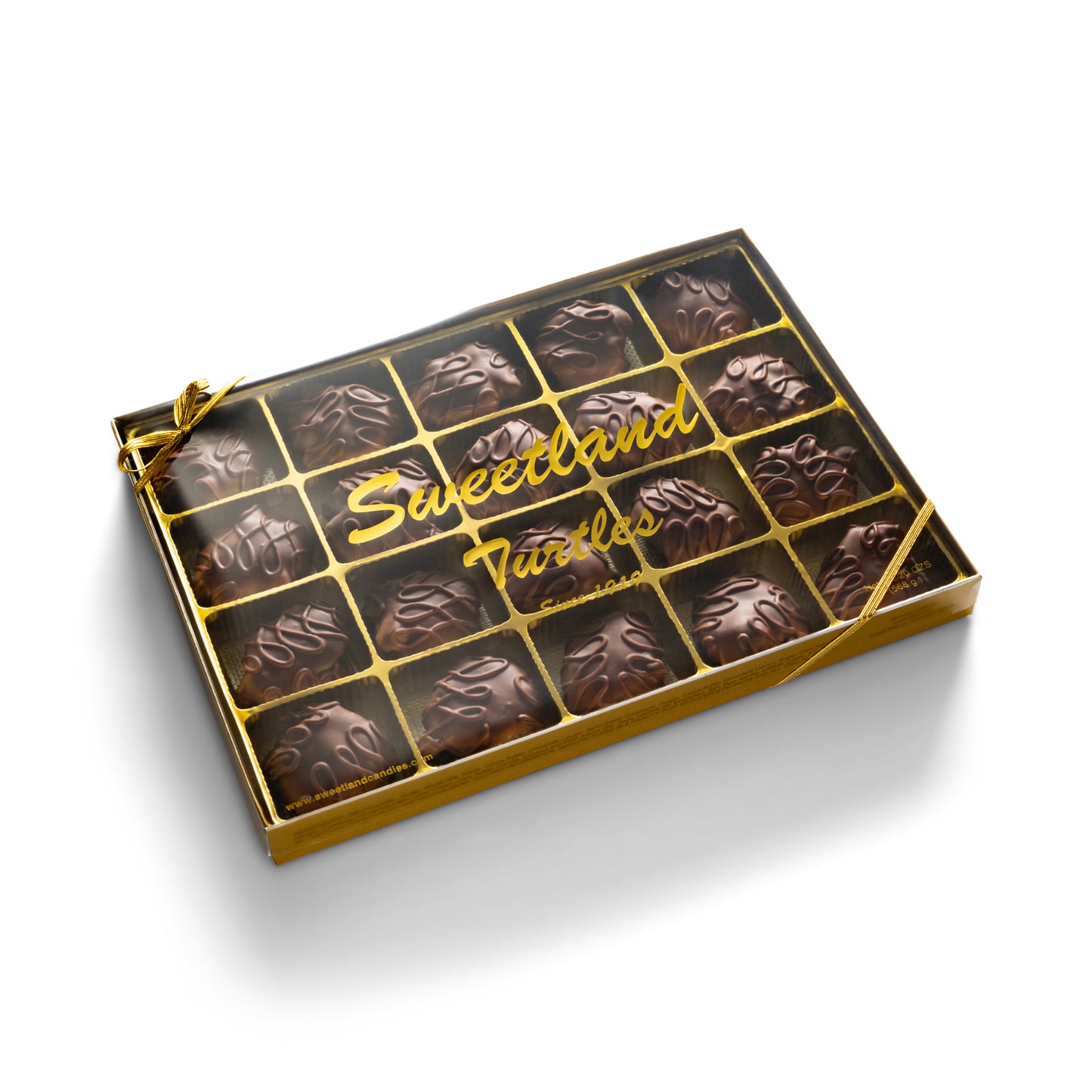 A gold gift box with 20 milk chocolate turtle candies