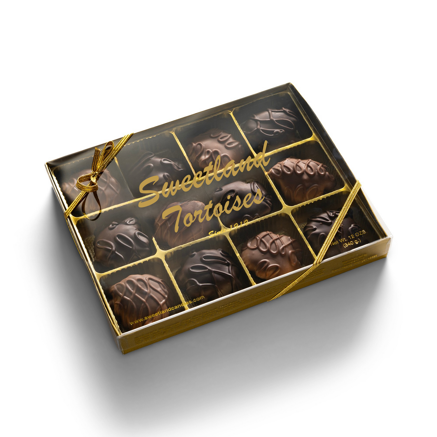 A gold gift box with 12 mixed chocolate turtle candies