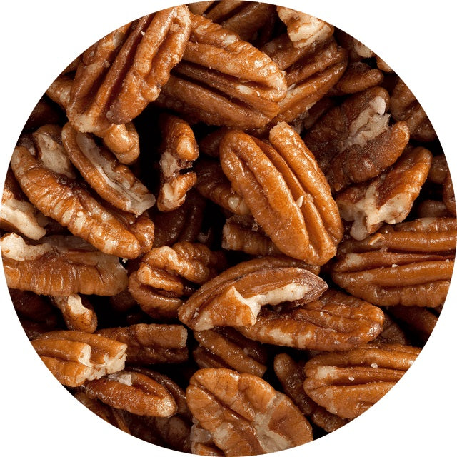 A circle image showing pecans roasted in canola oil with a light dusting of salt