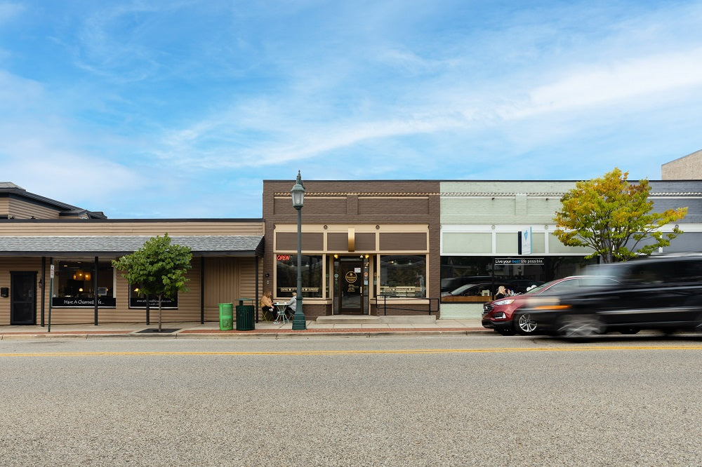 A storefront image of Sweetland Chocolates & Coffee location in downtown Rockford, Michigan