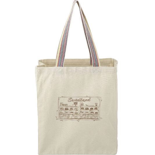 Beige tote bag with colorful handles and a printed design on a white background